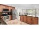 Modern kitchen featuring stainless steel appliances, granite counters, and central island with breakfast bar at 7579 Jay Ct, Arvada, CO 80003