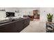 Cozy living room flowing into the kitchen with modern finishes at 7579 Jay Ct, Arvada, CO 80003