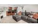 Inviting living room area with open layout, connecting to a modern kitchen and breakfast bar at 7579 Jay Ct, Arvada, CO 80003