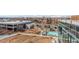 A scenic aerial view showcases a modern building with a pool and walking paths, offering urban living at 4200 W 17Th Ave # 508, Denver, CO 80204
