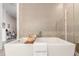 Elegant bathroom featuring a soaking tub and glass enclosed shower at 4200 W 17Th Ave # 508, Denver, CO 80204
