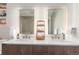 Bathroom featuring double vanity, modern sinks, sleek tile, and contemporary decor at 4200 W 17Th Ave # 508, Denver, CO 80204