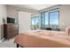 Comfortable bedroom with scenic views, a sliding door, and modern furnishings at 4200 W 17Th Ave # 508, Denver, CO 80204