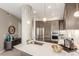 Stylish kitchen featuring stainless steel appliances, a large island, and designer lighting fixtures at 4200 W 17Th Ave # 508, Denver, CO 80204