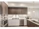 Modern kitchen with sleek cabinetry, stainless steel appliances, and stylish lighting fixtures at 4200 W 17Th Ave # 508, Denver, CO 80204