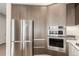 Modern kitchen featuring stainless steel appliances, sleek cabinetry, and stylish design at 4200 W 17Th Ave # 508, Denver, CO 80204