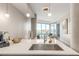 Bright and modern kitchen featuring a spacious counter island and open layout into living area at 4200 W 17Th Ave # 508, Denver, CO 80204