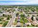 Aerial view showcasing a property with a well-manicured lawn and access to a major road with commercial amenities at 9225 Lowell Blvd, Westminster, CO 80031