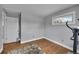 Small bedroom features a single window with outside view, a closet and wood floors at 9225 Lowell Blvd, Westminster, CO 80031