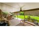 Beautiful covered patio with outdoor seating and well-manicured backyard at 9225 Lowell Blvd, Westminster, CO 80031