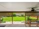 Relaxing covered patio overlooking a lush backyard with beautiful landscaping at 9225 Lowell Blvd, Westminster, CO 80031