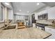 Modern kitchen featuring white cabinets, granite countertops, stainless steel appliances, and hardwood floors at 9225 Lowell Blvd, Westminster, CO 80031