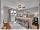Elegant primary bedroom with neutral walls, ceiling fan, and two windows with outside view at 9225 Lowell Blvd, Westminster, CO 80031