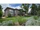 Spacious backyard with lush lawn and landscaping offering a serene outdoor space for relaxation and recreation at 6584 S Sedalia St, Aurora, CO 80016