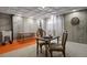 Basement area with a concrete wall, dart board, wash basin, chairs and table, ready for various activities at 6584 S Sedalia St, Aurora, CO 80016
