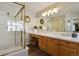 Modern bathroom with glass shower, stylish vanity, and ample natural light at 6584 S Sedalia St, Aurora, CO 80016