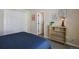 Bedroom with art, blue bedding, closet and doorway at 6584 S Sedalia St, Aurora, CO 80016