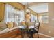 Charming breakfast nook with a cozy window seat and modern lighting fixture at 6584 S Sedalia St, Aurora, CO 80016