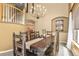Dining area with dark wood table and chairs at 6584 S Sedalia St, Aurora, CO 80016