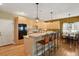 Bright kitchen featuring a breakfast bar and stainless steel appliances at 6584 S Sedalia St, Aurora, CO 80016