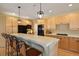 Kitchen with bar seating and modern appliances at 6584 S Sedalia St, Aurora, CO 80016