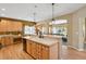 Kitchen island with sink and bar seating at 6584 S Sedalia St, Aurora, CO 80016