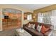 Inviting living room features a plush leather sofa and open floor plan at 6584 S Sedalia St, Aurora, CO 80016
