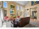 Elegant living room with high ceilings, large windows, and stylish decor at 6584 S Sedalia St, Aurora, CO 80016