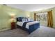 Comfortable main bedroom with neutral colors and a large window view at 6584 S Sedalia St, Aurora, CO 80016