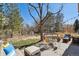 Outdoor patio with ample seating under mature trees, perfect for relaxing and entertaining on sunny days at 6584 S Sedalia St, Aurora, CO 80016