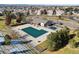 Aerial view of community pool featuring a covered pool and snow covered ground at 6584 S Sedalia St, Aurora, CO 80016