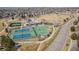 Aerial view of community sports courts; featuring tennis courts and a basketball court at 6584 S Sedalia St, Aurora, CO 80016