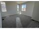Bright carpeted bedroom with two windows and plenty of space at 6658 N Nepal Ct, Aurora, CO 80019