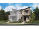 Modern two-story home with stone accents, neutral siding, and a well-maintained lawn at 6658 N Nepal Ct, Aurora, CO 80019