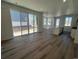 Open concept living area with large sliding doors, kitchen, and lots of sunlight at 6658 N Nepal Ct, Aurora, CO 80019