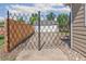 View of the backyard showing the fence, gate, and detached garage at 1023 S Alcott St, Denver, CO 80219