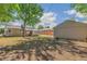 An expansive backyard with the house, garage, and green space at 1023 S Alcott St, Denver, CO 80219