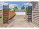 Gated driveway leading to a detached garage, adding privacy and security at 1023 S Alcott St, Denver, CO 80219
