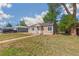 Charming single-story home with a well-kept lawn and sidewalk at 1023 S Alcott St, Denver, CO 80219