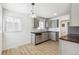 Bright kitchen with stainless steel appliances, light grey cabinets and wood countertop at 1023 S Alcott St, Denver, CO 80219