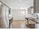 Updated kitchen featuring stainless steel appliances and abundant natural light at 1023 S Alcott St, Denver, CO 80219