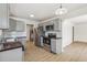 Modern kitchen with stainless steel appliances, gray cabinets, and wood countertop at 1023 S Alcott St, Denver, CO 80219