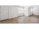 Light-filled living room featuring hardwood floors and fresh paint at 1023 S Alcott St, Denver, CO 80219