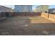 Large backyard ready for landscaping, surrounded by a wood fence at 47375 Lilac Ave, Bennett, CO 80102