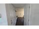 Bright entryway features wood-look floors and access to the rest of the home at 47375 Lilac Ave, Bennett, CO 80102