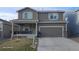 Charming two-story home with a two car garage, covered porch and easy to maintain lawn at 47375 Lilac Ave, Bennett, CO 80102