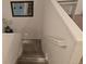 Carpeted stairway with white walls and recessed lighting leading to the upper level of the home at 47375 Lilac Ave, Bennett, CO 80102