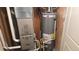 Utility room features a new Carrier furnace and Rheem Classic Series water heater at 47375 Lilac Ave, Bennett, CO 80102