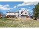 Townhome backyard featuring a grass lawn and wood fence under a bright sky at 1620 S Ivory Cir # C, Aurora, CO 80017