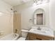 Bathroom features a tub-shower combination and a wooden vanity with a modern sink at 1620 S Ivory Cir # C, Aurora, CO 80017
